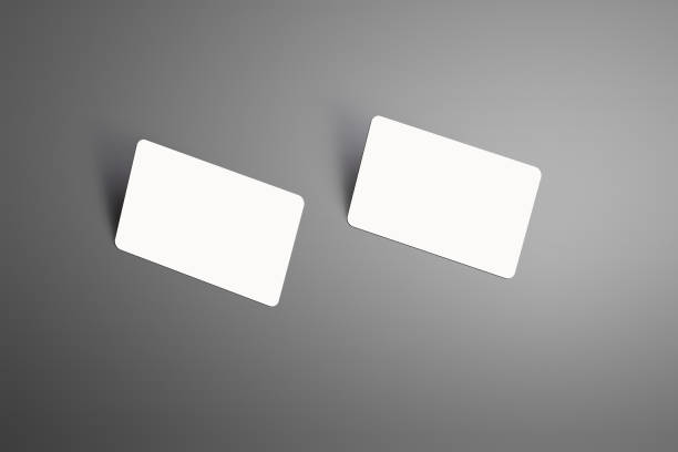 istock Realistic mockup of a two  bank gift cards with shadows  isolated on a studio background. 950603976