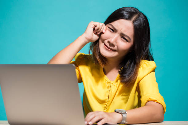 istock Woman so sad when she look at laptop 950604508