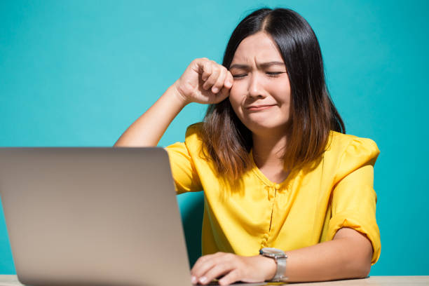 istock Woman so sad when she look at laptop 950604606
