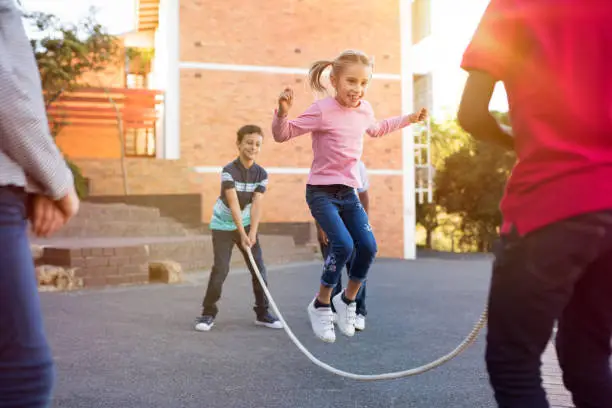 Photo of Children playing with skipping rope