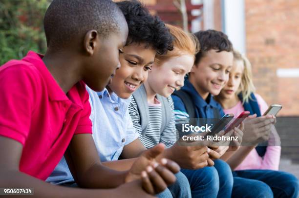 Children Using Smart Phone Stock Photo - Download Image Now - Child, Mobile Phone, Smart Phone