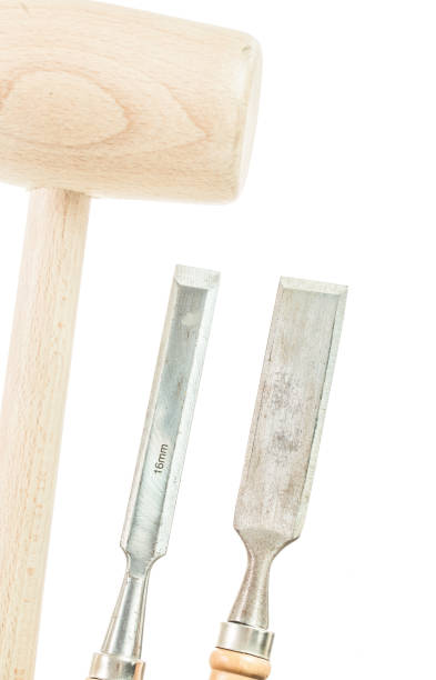 istock Flat chisels wooden mallet isolated on white 950607564