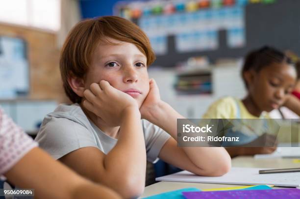 Bored School Boy In Class Stock Photo - Download Image Now - Child, School Building, Education