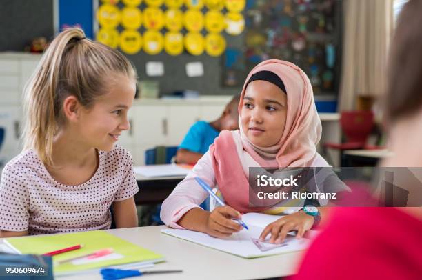 Muslim Girl With Her Classmate Stock Photo - Download Image Now - Child, Education, School Building