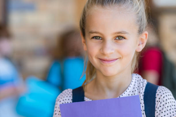 istock Happy girl at elementary school 950609824