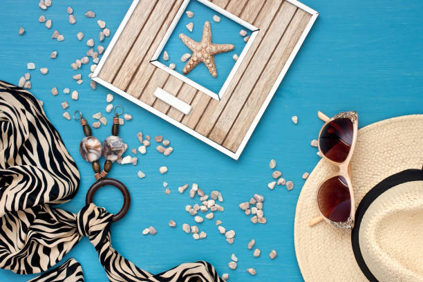 istock Sunglasses and wicker hat on table 950613136
