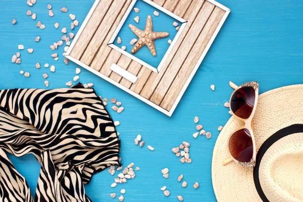 istock Sunglasses and wicker hat on table 950613162