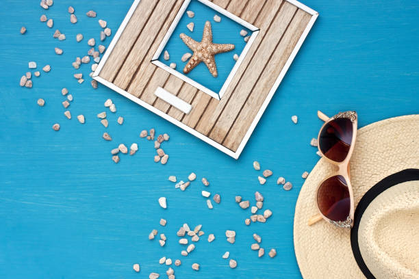 istock Sunglasses and wicker hat on table 950613188