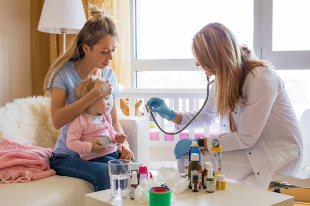 Doctor visit sick baby at home Doctor visit sick baby at home. General practitioner visits little patient at home. bronchitis stock pictures, royalty-free photos & images