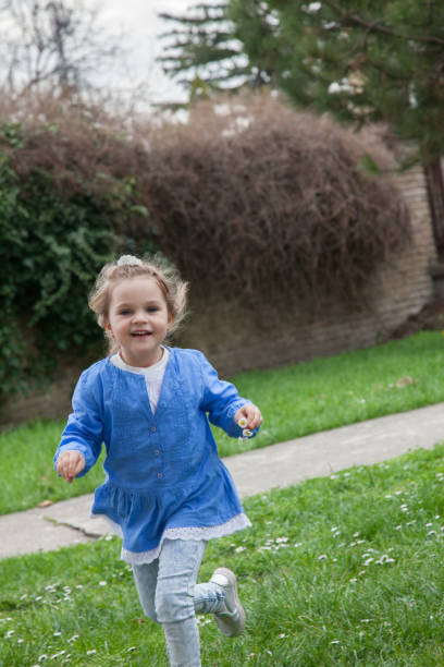 istock Girl running at the park 950623012