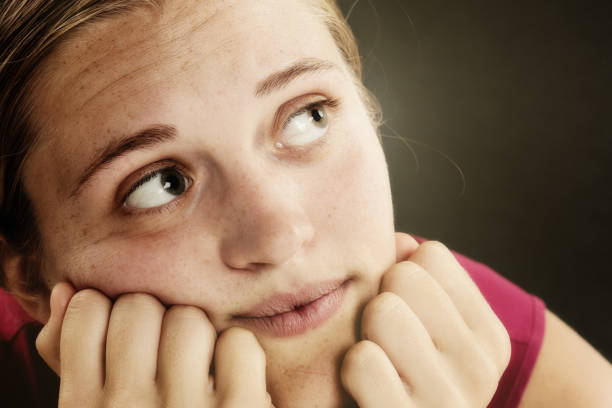 istock Daydreaming young woman deep in thought 950623592