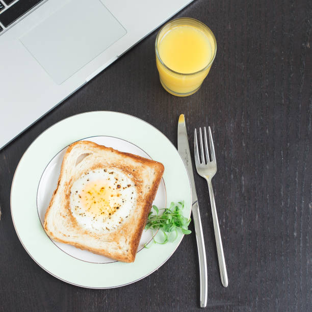 istock Business breakfast. Egg fried in toast with orange juice 950624544