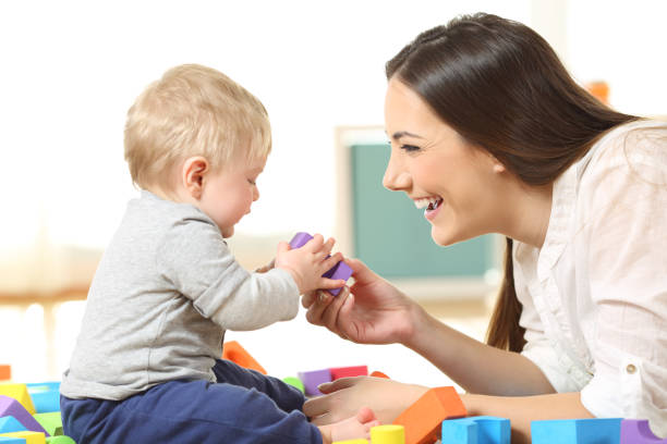 istock Mother and son playing on the floor 950625342