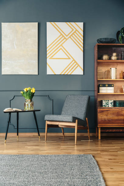 istock Upholstered chair and wooden bookcase 950629436