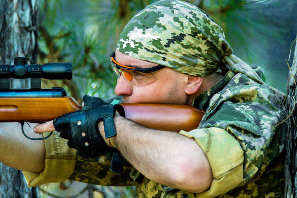 istock young man with an air rifle 950629724