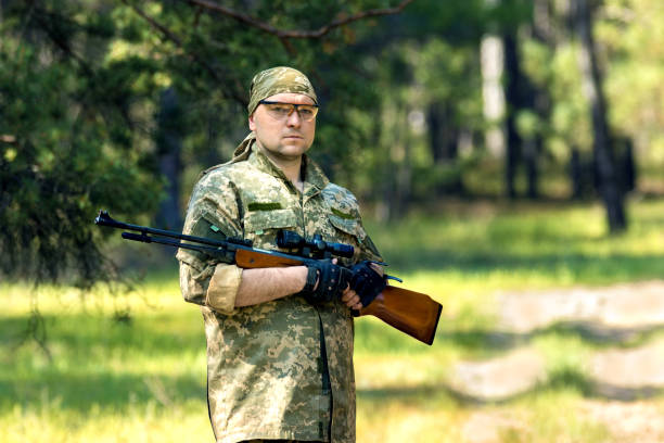 istock young man with an air rifle 950629790