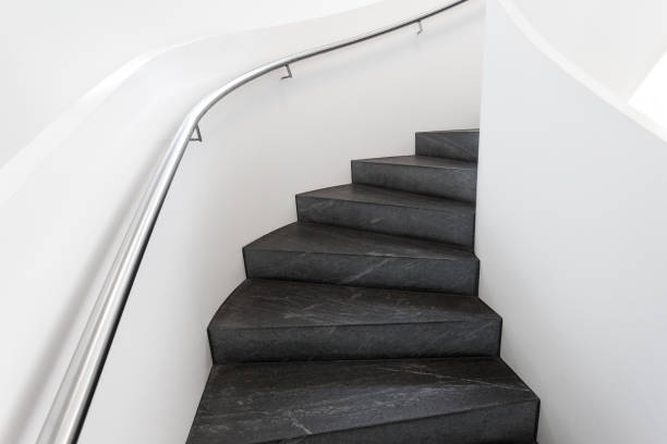 istock Modern black and white staircase in house 950637634