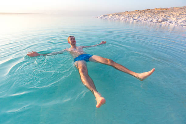 istock Tourist swims in Dead Sea. Jordan 950638096