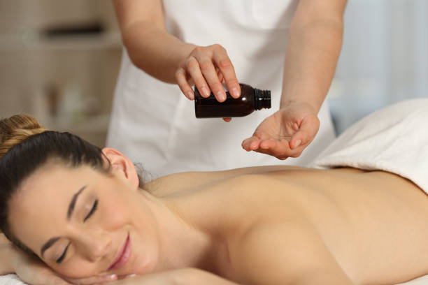 istock Massage therapist applying product 950639578