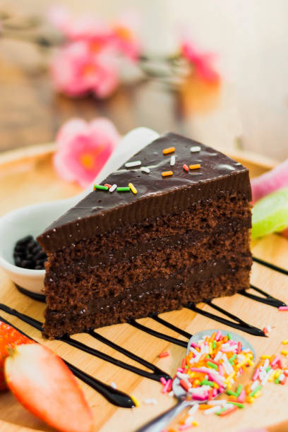 istock Piece of Chocolate cake with sweet topping 950643536