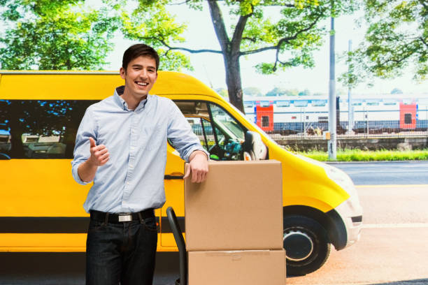 istock Pacakge delivery man is dropping of packages 950643768