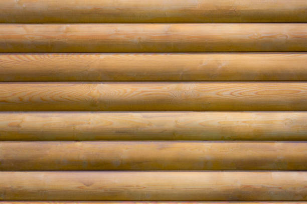 istock brown wooden logs wall 950644446