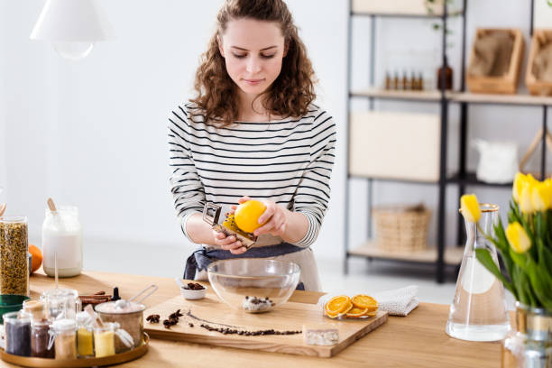 istock Girl peeling orange 950645640