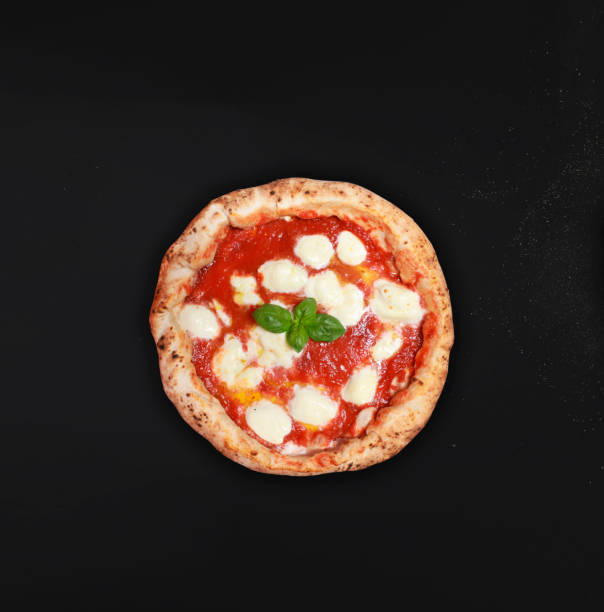 Neapolitan pizza Neapolitan pizza on a black background, ideal for banners to print or for websites, pizza vesuvius, naples. The real Italian pizza. active volcano photos stock pictures, royalty-free photos & images
