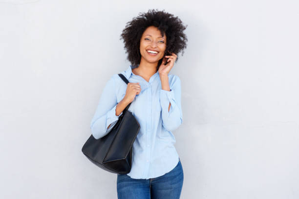 istock smiling african american woman talking on cellphone 950646510