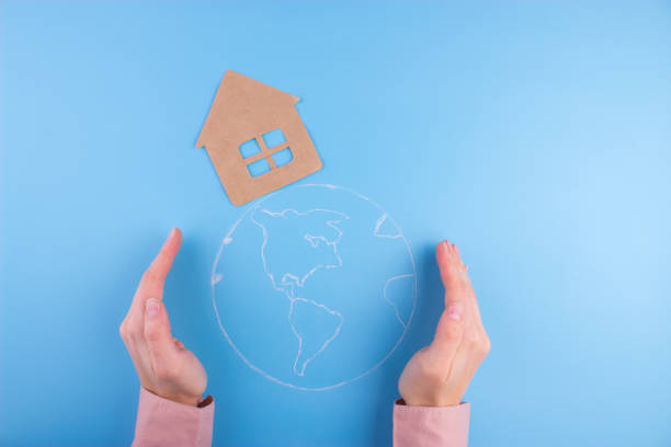 istock Our home - woman holding earth 950648984