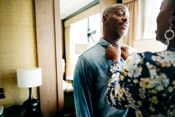 Woman helping her partner in dressing up