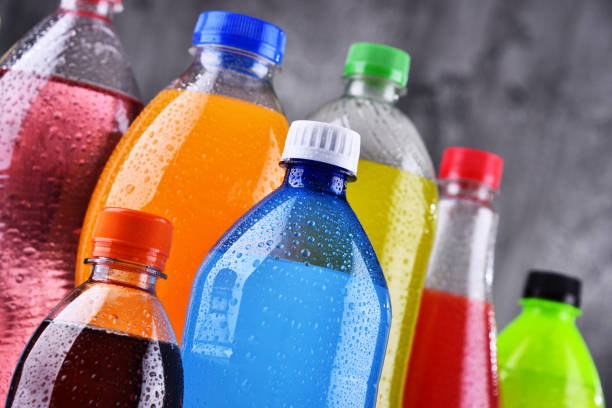 Plastic bottles of assorted carbonated soft drinks Plastic bottles of assorted carbonated soft drinks in variety of colors soda bottle stock pictures, royalty-free photos & images