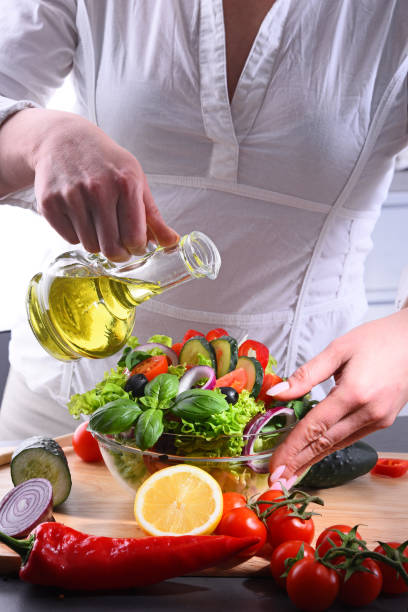 istock Preparation of a vegetable salad from fresh organic ingredients 950653276