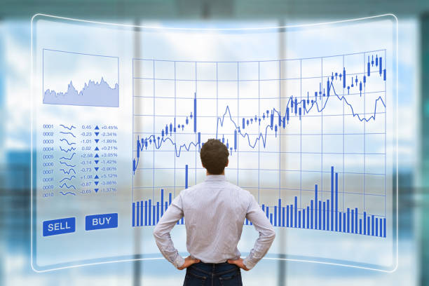 istock Trader analyzing forex trading charts with sell buy buttons, investment 950654250