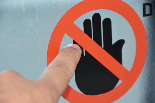 istock Finger touching a sign is not allowed to touch 950655102