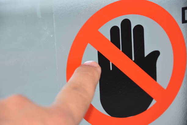 istock Finger touching a sign is not allowed to touch 950655550