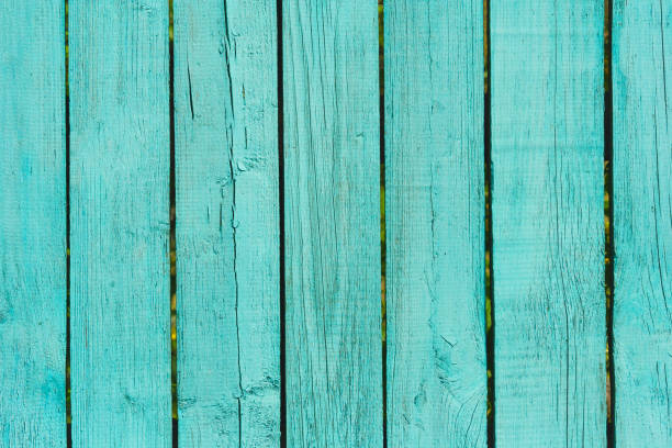 istock Old wooden fence from planks painted turquoise 950659156