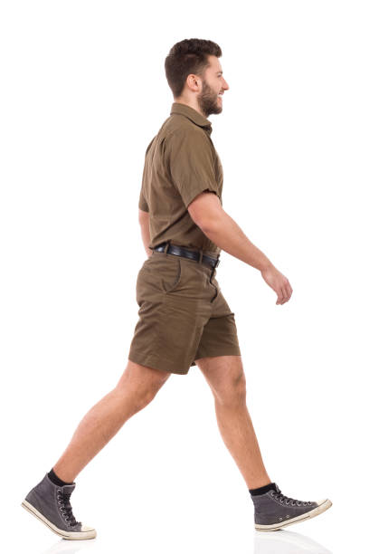 istock Messenger In Khaki Uniform Is Walking And Smiling 950659856