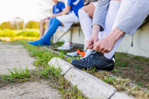 istock Tying his bootlaces before the soccer game 950671476