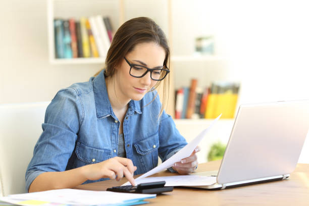 istock Woman doing accounting at home 950674466