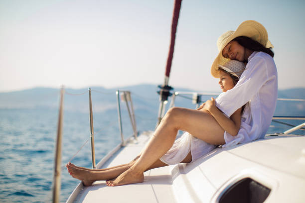 istock Mother and daughter enjoying on yacht 950676626