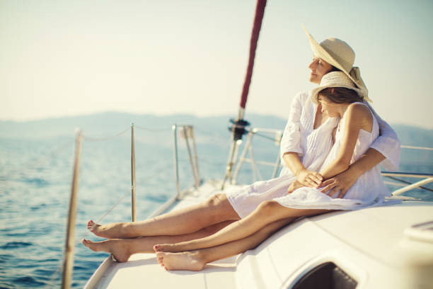 istock Mother and daughter enjoying on yacht 950676632