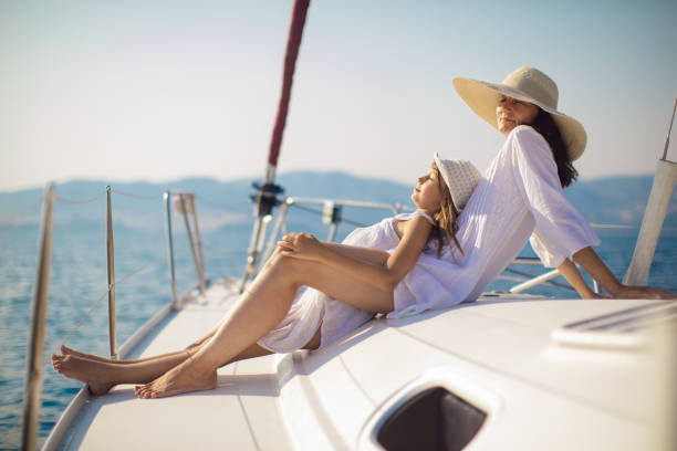istock Mother and daughter enjoying on yacht 950677206