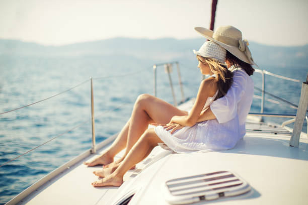 istock Mother and daughter enjoying on yacht 950677292