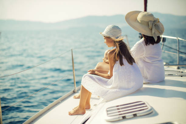 istock Mother and daughter enjoying on yacht 950677578