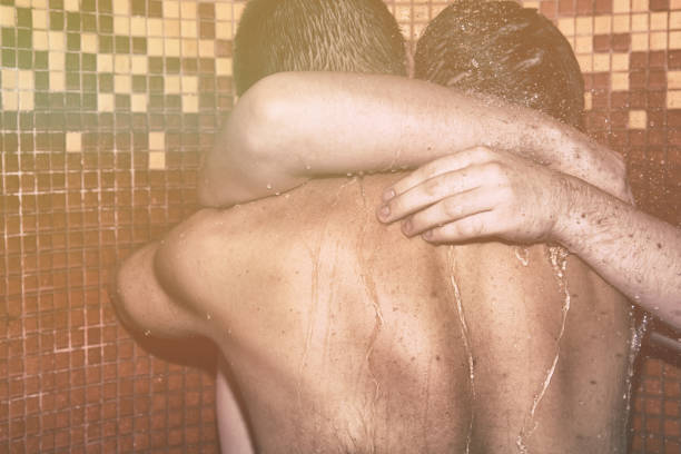 two men in the shower. love and romance. - homosexual beautiful sensuality love imagens e fotografias de stock