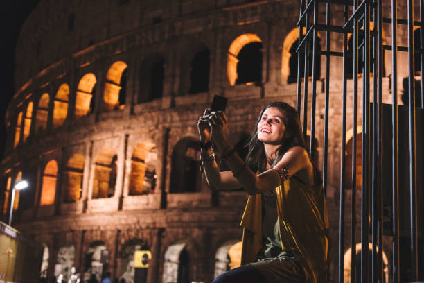 istock Smiling girl with phone 950679936