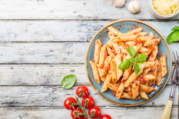 istock Penne pasta in tomato sauce 950680130