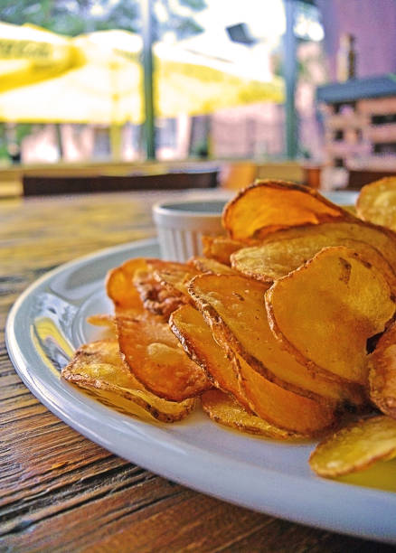 istock Plate of home made potato chips with sauce. 950683414