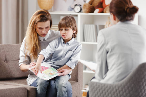 istock Mother with autistic child 950683756